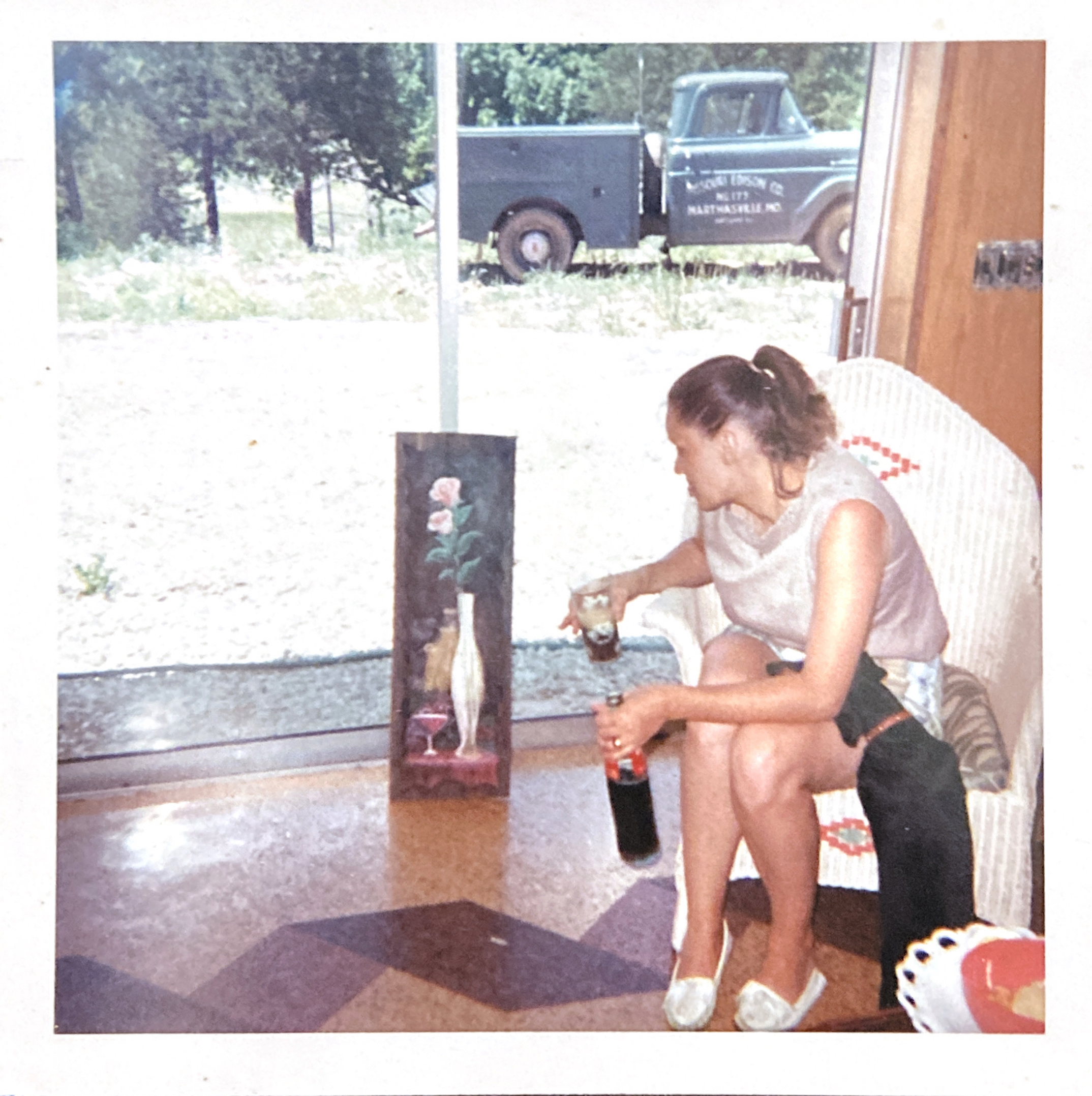 May 1966, Barbara Beans (Bob’s wife) visiting during Mom’s painting class in our basement. The painting is by Mom's friend and painting teacher, Ellen Verges — oil paints on old barn wood.